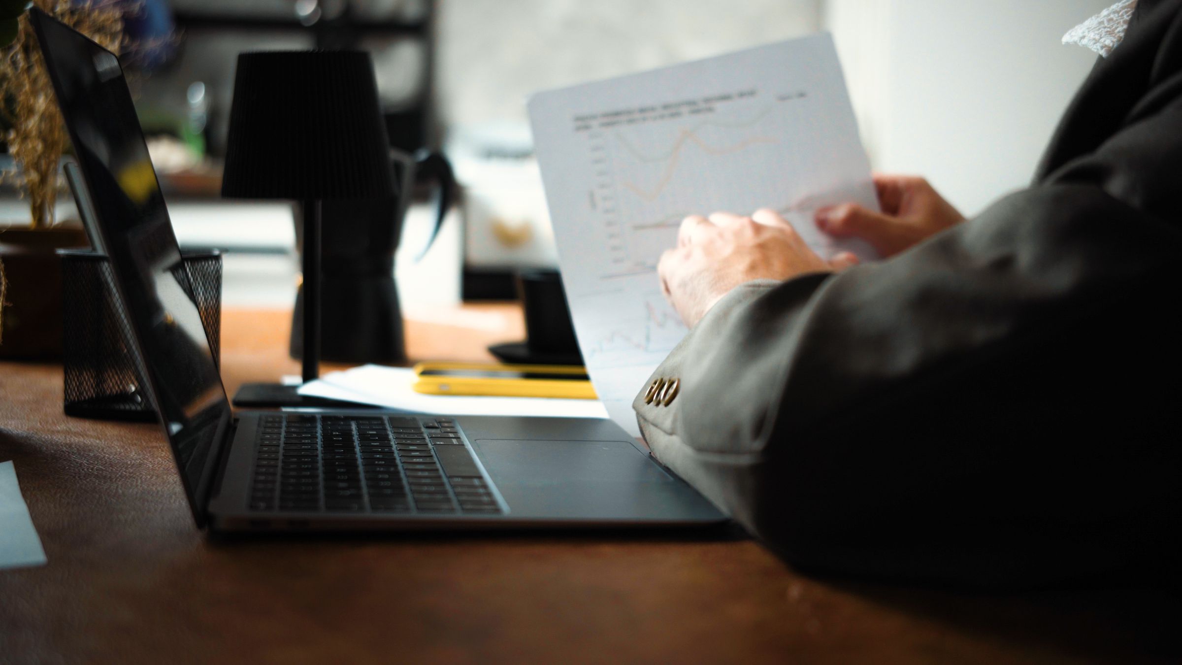 Reviewing a printed performance chart at a desk